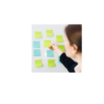Woman sorting post-it notes with titles of materials to determine the list of materials to give to the selection committee